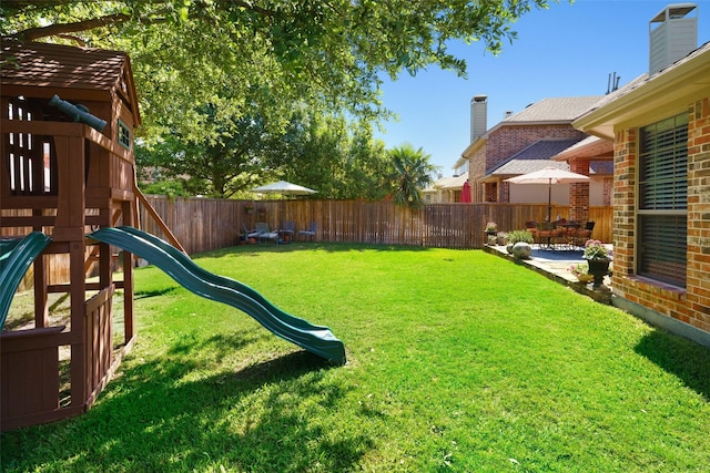 7716 Glenwood Springs Ln, Mckinney, TX 75070 - fenced backyard featuring a playground and a patio