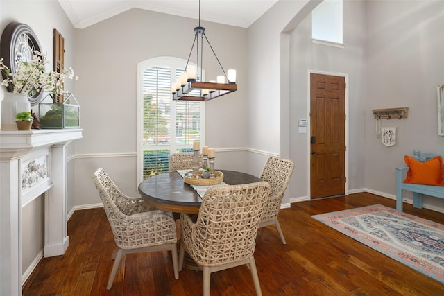 7716 Glenwood Springs Ln, Mckinney, TX 75070 - dining space with ornamental molding, wood finished floors, a chandelier, arched walkways, and vaulted ceiling