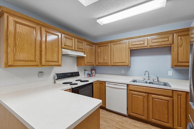 5521 Alta Verde Cir, Arlington, TX 76017 - kitchen featuring dishwasher, range with electric stovetop, under cabinet range hood, a peninsula, and light countertops