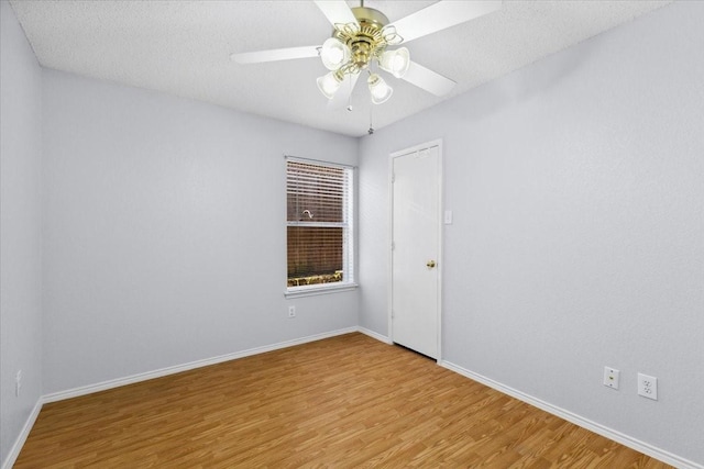 5521 Alta Verde Cir, Arlington, TX 76017 - unfurnished room with wood finished floors, ceiling fan, and a textured ceiling