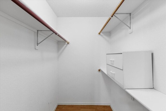 5521 Alta Verde Cir, Arlington, TX 76017 - walk in closet with wood finished floors