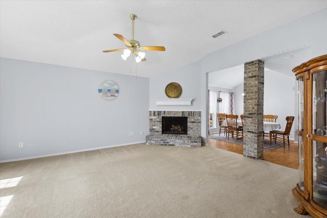 5521 Alta Verde Cir, Arlington, TX 76017 - living room with vaulted ceiling, carpet floors, ceiling fan, and a brick fireplace