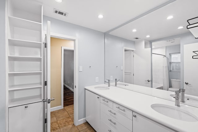 1432 Foothill Dr, Hurst, TX 76053 - bathroom with double vanity, recessed lighting, and shower / bathtub combination with curtain
