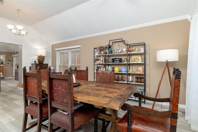 874 Havenbrook Dr, Arlington, TX 76001 - dining area with ornamental molding, light wood-style floors, vaulted ceiling, and a chandelier