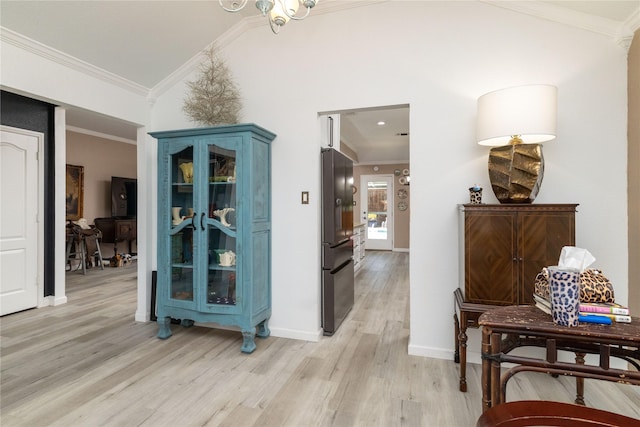 874 Havenbrook Dr, Arlington, TX 76001 - hall with vaulted ceiling, light wood finished floors, and ornamental molding