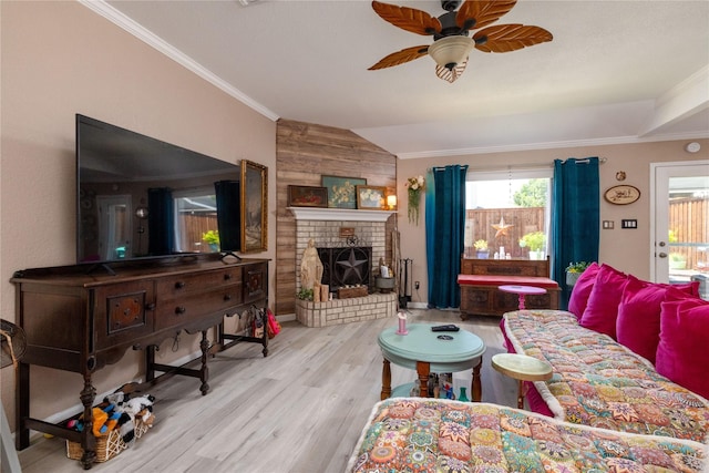 874 Havenbrook Dr, Arlington, TX 76001 - living room featuring ceiling fan, wood finished floors, lofted ceiling, a brick fireplace, and ornamental molding