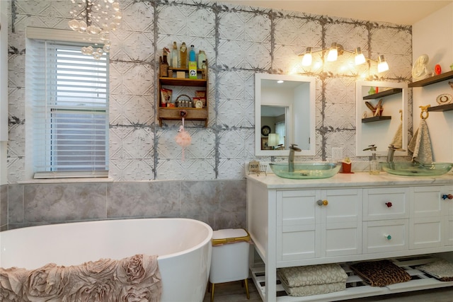 874 Havenbrook Dr, Arlington, TX 76001 - full bath featuring a chandelier, a freestanding tub, double vanity, and tile walls
