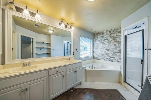 17 Zachary Ct, Mansfield, TX 76063 - full bathroom featuring a bath, a stall shower, hardwood / wood-style floors, and double vanity