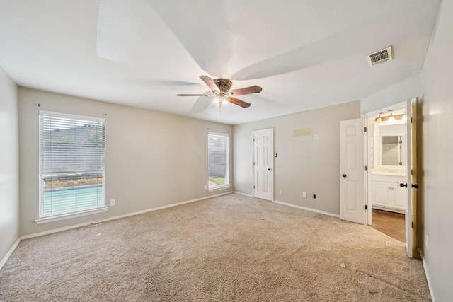 17 Zachary Ct, Mansfield, TX 76063 - unfurnished bedroom featuring carpet, ensuite bathroom, and a ceiling fan