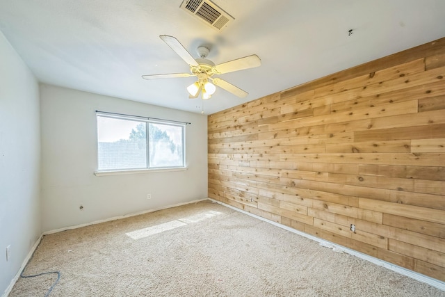 17 Zachary Ct, Mansfield, TX 76063 - carpeted empty room featuring wood walls and a ceiling fan