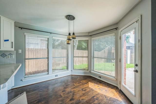 17 Zachary Ct, Mansfield, TX 76063 - unfurnished dining area with dark wood-style floors and baseboards