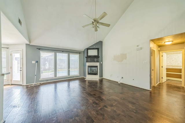 17 Zachary Ct, Mansfield, TX 76063 - unfurnished living room with high vaulted ceiling, ceiling fan, plenty of natural light, dark wood-style flooring, and a glass covered fireplace