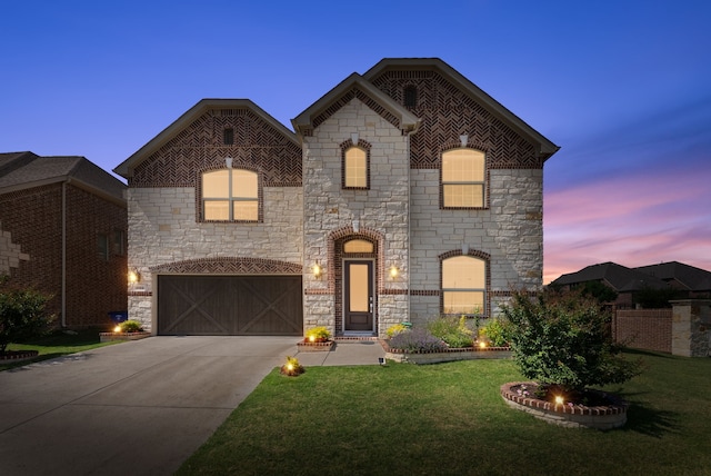 8133 Blumelia Dr, Dallas, TX 75252 - french country home featuring stone siding, an attached garage, concrete driveway, and a lawn