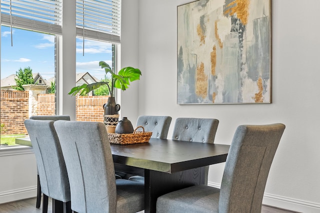 8133 Blumelia Dr, Dallas, TX 75252 - dining area with wood finished floors