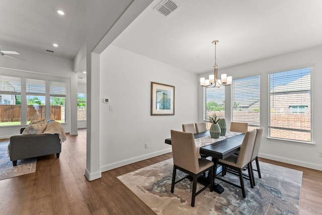 8133 Blumelia Dr, Dallas, TX 75252 - dining room featuring plenty of natural light, wood finished floors, a chandelier, and recessed lighting