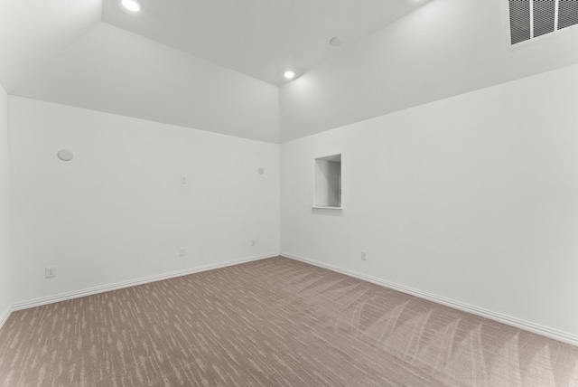 8133 Blumelia Dr, Dallas, TX 75252 - spare room featuring carpet flooring, vaulted ceiling, and recessed lighting