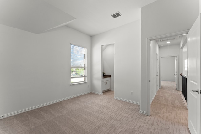8133 Blumelia Dr, Dallas, TX 75252 - unfurnished bedroom with attic access, lofted ceiling, and light carpet