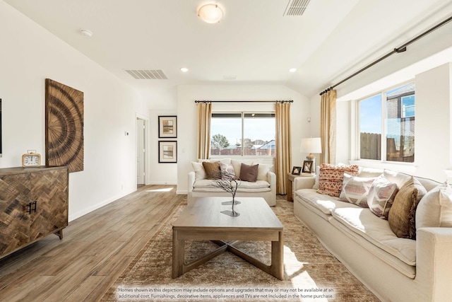 111 Cedar Grove Ct, Lavon, TX 75166 - living room with plenty of natural light, light wood-type flooring, vaulted ceiling, and recessed lighting