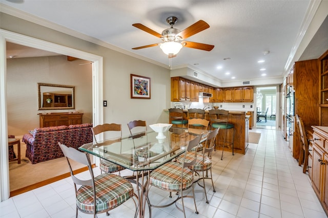 100 La Paz Ct, Irving, TX 75062 - dining space with ornamental molding, ceiling fan, and light tile patterned floors