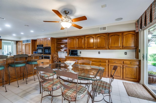 100 La Paz Ct, Irving, TX 75062 - dining space with ornamental molding, a ceiling fan, and light tile patterned flooring