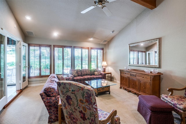 100 La Paz Ct, Irving, TX 75062 - living room with lofted ceiling, light colored carpet, healthy amount of natural light, ceiling fan, and a textured ceiling