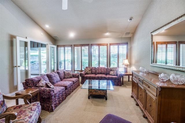 100 La Paz Ct, Irving, TX 75062 - living area with vaulted ceiling, light colored carpet, and a ceiling fan