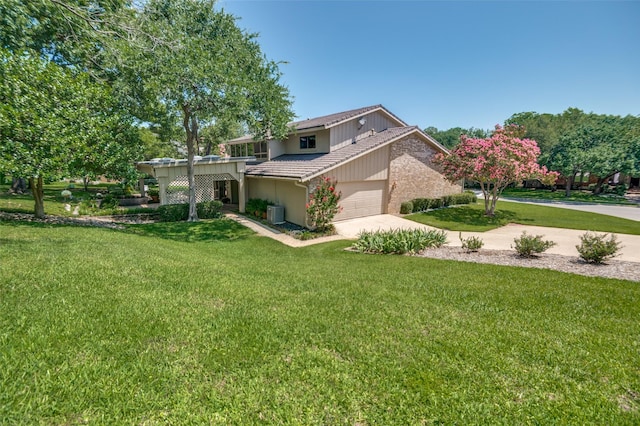 100 La Paz Ct, Irving, TX 75062 - view of front of property with driveway, a garage, and a front yard