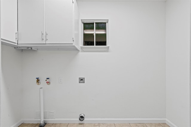 7005 Culver Ave, Fort Worth, TX 76116 - laundry area featuring electric dryer hookup, cabinet space, and washer hookup