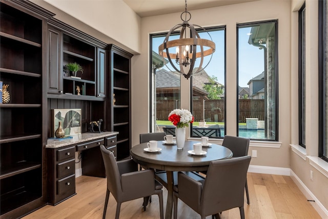 3208 Twin Eagles Dr, Celina, TX 75009 - dining space featuring light wood-style floors, a chandelier, and an office area