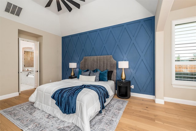 3208 Twin Eagles Dr, Celina, TX 75009 - bedroom featuring light wood-style floors, lofted ceiling, a ceiling fan, and connected bathroom