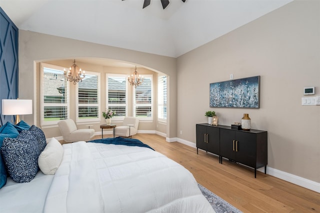 3208 Twin Eagles Dr, Celina, TX 75009 - bedroom featuring a chandelier, light wood-style flooring, vaulted ceiling, arched walkways, and ceiling fan