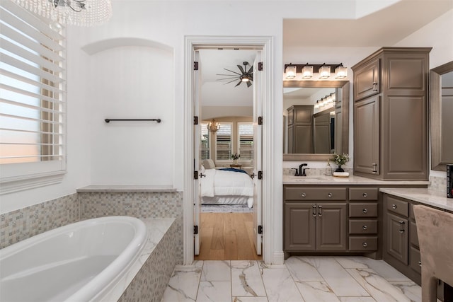 3208 Twin Eagles Dr, Celina, TX 75009 - full bathroom featuring a bath, marble look tile flooring, vanity, and ensuite bath