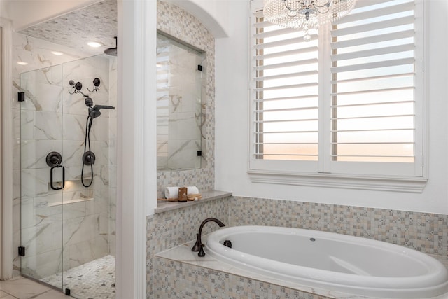 3208 Twin Eagles Dr, Celina, TX 75009 - full bathroom with a garden tub, a stall shower, and a chandelier