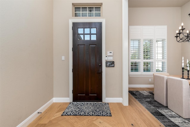 3208 Twin Eagles Dr, Celina, TX 75009 - foyer entrance featuring a chandelier and parquet flooring