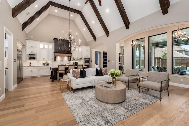 3208 Twin Eagles Dr, Celina, TX 75009 - living room featuring a chandelier, high vaulted ceiling, light wood-style floors, beamed ceiling, and recessed lighting