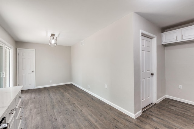 2406 Globe Ave, Dallas, TX 75228 - unfurnished dining area featuring dark wood-style flooring