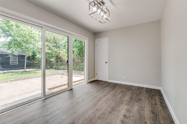 2406 Globe Ave, Dallas, TX 75228 - spare room featuring baseboards and wood finished floors