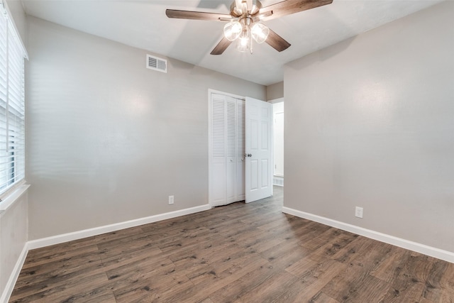 2406 Globe Ave, Dallas, TX 75228 - unfurnished bedroom featuring wood finished floors, a closet, and a ceiling fan