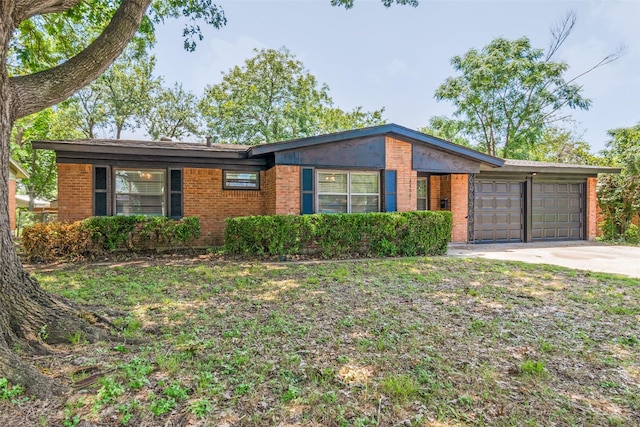2406 Globe Ave, Dallas, TX 75228 - ranch-style house featuring a garage, driveway, and brick siding