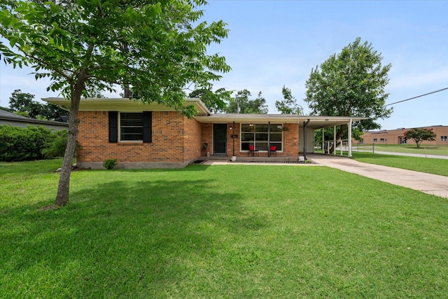 2040 Bowie Dr, Corsicana, TX 75110 - view of front of house featuring concrete driveway, a front yard, brick siding, and an attached carport