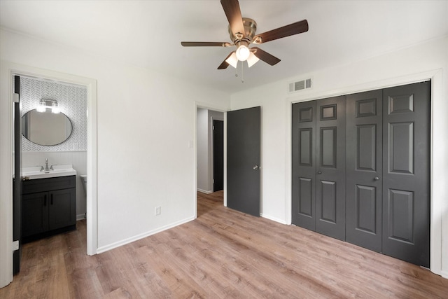 2040 Bowie Dr, Corsicana, TX 75110 - unfurnished bedroom with a closet, light wood-type flooring, and ceiling fan
