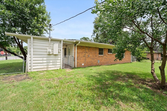 2040 Bowie Dr, Corsicana, TX 75110 - rear view of property featuring brick siding and a gate