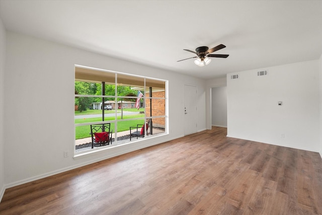 2040 Bowie Dr, Corsicana, TX 75110 - spare room featuring wood finished floors and ceiling fan