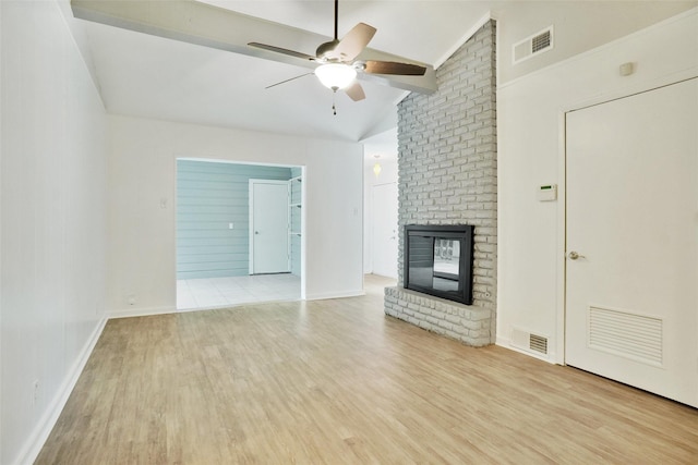 108 Sunnyvale Ter, Hurst, TX 76053 - unfurnished living room featuring wood finished floors, lofted ceiling, ceiling fan, and a fireplace