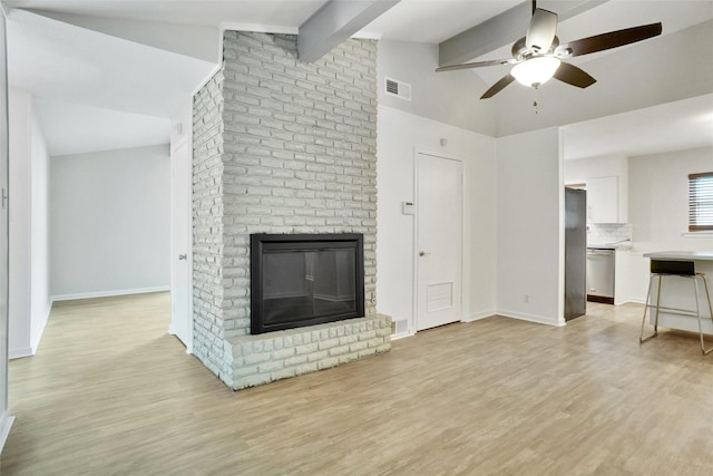 108 Sunnyvale Ter, Hurst, TX 76053 - unfurnished living room with ceiling fan, light wood-type flooring, and a fireplace