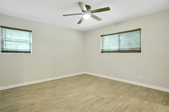 108 Sunnyvale Ter, Hurst, TX 76053 - unfurnished room with plenty of natural light, light wood-style flooring, and a ceiling fan