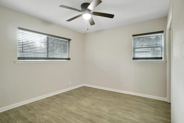 108 Sunnyvale Ter, Hurst, TX 76053 - spare room with a ceiling fan, healthy amount of natural light, and wood finished floors