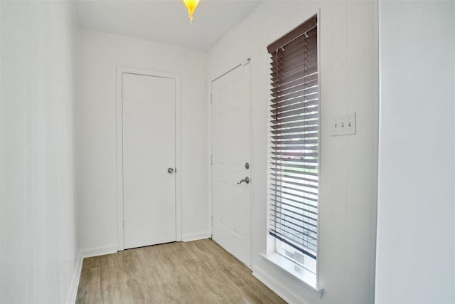 108 Sunnyvale Ter, Hurst, TX 76053 - doorway with light wood-type flooring and baseboards