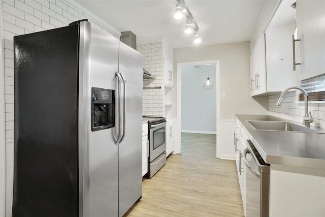 108 Sunnyvale Ter, Hurst, TX 76053 - kitchen featuring appliances with stainless steel finishes, stainless steel countertops, white cabinetry, and tasteful backsplash