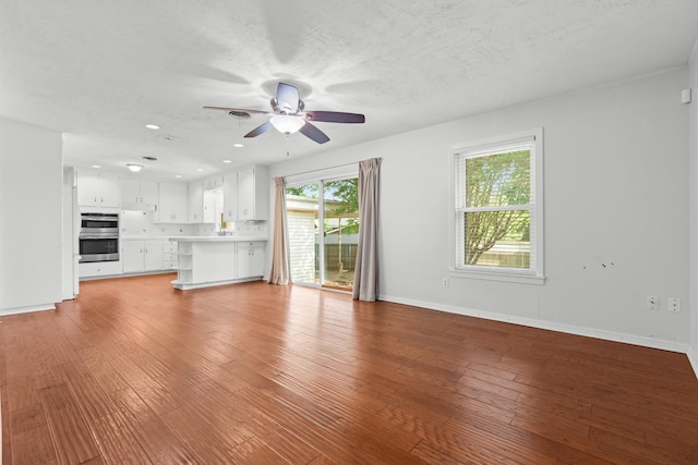 2333 Hermanson Dr, Waco, TX 76710 - unfurnished living room featuring ceiling fan, wood finished floors, and recessed lighting